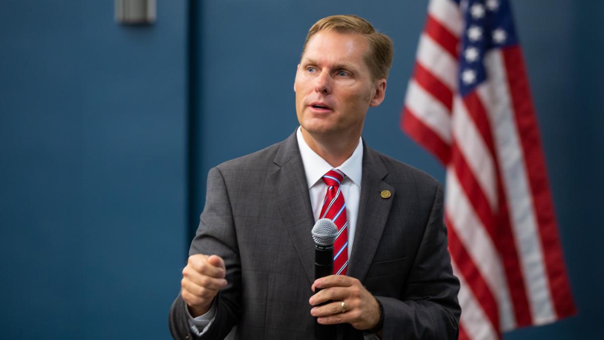 Guest in Front of Flag